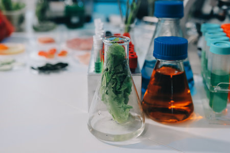 Team of scientists in a lab conducting food research using a microscope and lab equipment, showcasing innovation in food science and biotechnologyの写真素材