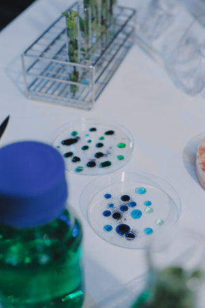 Team Asian scientists in a lab conducting food research using a microscope and lab equipment,...