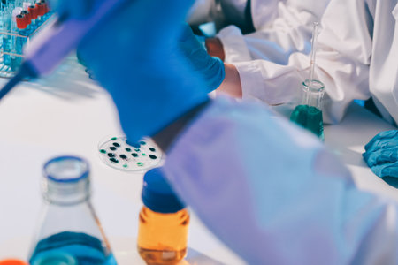 Chemists in a lab developing cosmetic products, testing and analyzing formulas for quality and effectiveness.の写真素材