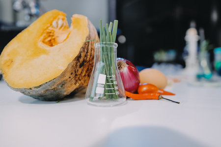 Team Asian scientists in a lab conducting food research using a microscope and lab equipment, showcasing innovation in food science and biotechnologyの写真素材