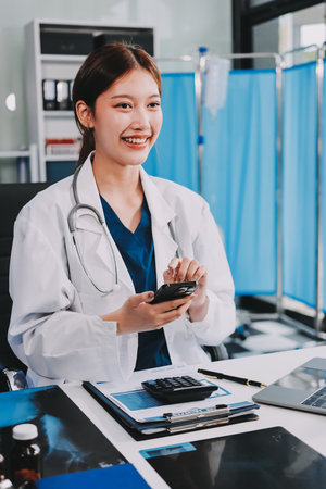 Medical health clinic doctor working using smart tablet touching, stethoscope diagnosing patient analysis research examination healthcare provider service insurance in modern officeの写真素材