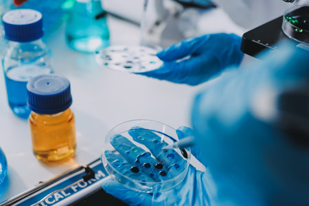 Chemists in a lab testing and analyzing formulas for quality and effectiveness.の写真素材