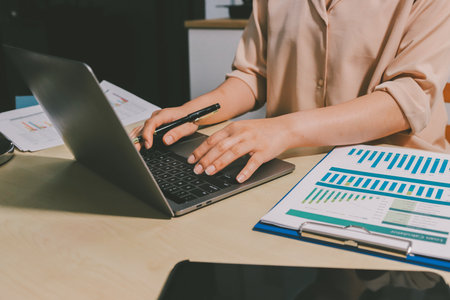 Tax deduction planning concept. Women use a calculator to calculate expenses and taxes to receive tax deductions for personal individual Income. tax return for individual persons.monthly expensesの写真素材