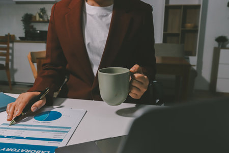 Tax deduction planning concept. Women use a calculator to calculate expenses and taxes to receive tax deductions for personal individual Income. tax return for individual persons.monthly expensesの写真素材