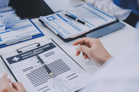 Male and female doctors are having a meeting in a room.の写真素材