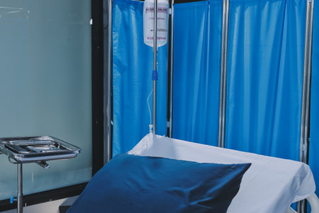 side view of empty hospital bed in clinic chamberの写真素材