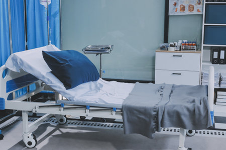 side view of empty hospital bed in clinic chamberの写真素材