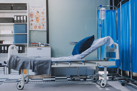 side view of empty hospital bed in clinic chamberの写真素材