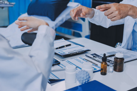 Male and female doctors are having a meeting in a hospital room.