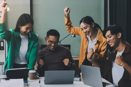 Business team showing unity with their hands together, Close up top view of young business people putting their hands together. people together to work as team to ensure the success of the businessの写真素材