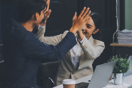 Business team showing unity, Close up top view of young business people putting their hands together. people together to work as team to ensure the success of the businessの写真素材
