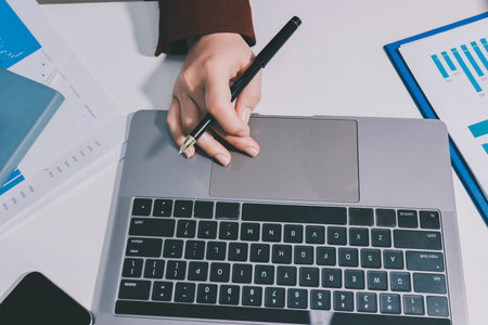 Tax deduction planning concept. Women use a calculator to calculate expenses and taxes to receive tax deductions for personal individual Income. tax return for individual persons.monthly expensesの写真素材