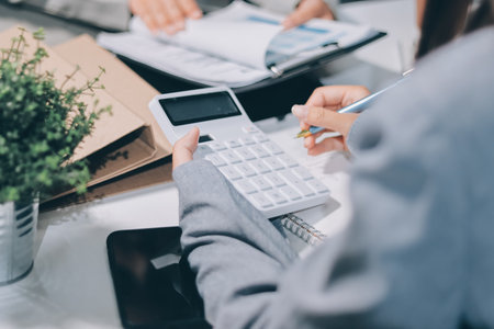Portrait of Asian young female working on laptop at officeの写真素材