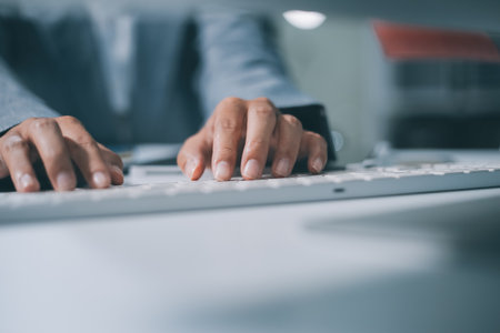 Portrait of Asian young female working on laptop at officeの写真素材