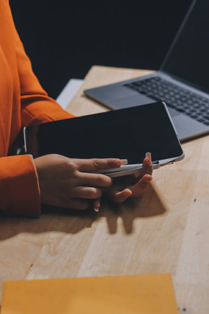 Businesswoman or accountant working Financial investment on calculator, calculate, analyze business and marketing growth on financial document data graph, Accounting, Economic, commercial concept.の写真素材