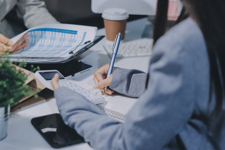 Portrait of Asian young female working on laptop at officeの写真素材