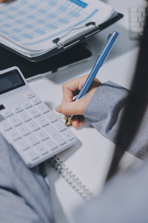 Portrait of Asian young female working on laptop at officeの写真素材