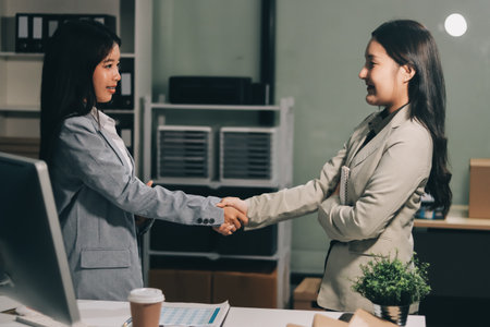 Business handshake for teamwork of business merger and acquisition,successful negotiate,hand shake,two businessman shake hand with partner to celebration partnership and business deal conceptの写真素材