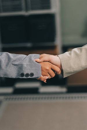 Business handshake for teamwork of business merger and acquisition,successful negotiate,hand shake,two businessman shake hand with partner to celebration partnership and business deal conceptの写真素材