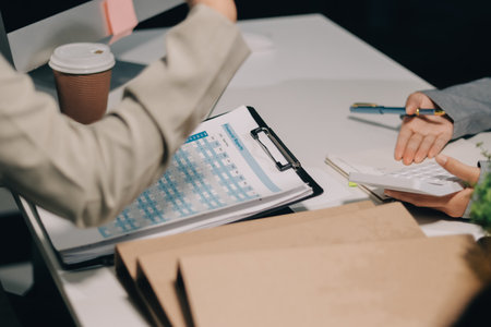 Portrait of Asian young female working on laptop at officeの写真素材