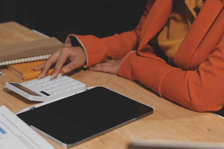 Businesswoman or accountant working Financial investment on calculator, calculate, analyze business...