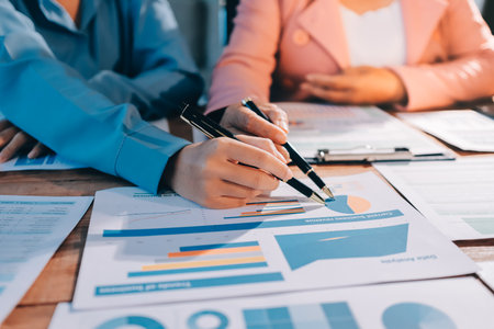 Business analyze,Close up Business people meeting to discuss the situation on the market. Business Financial Conceptの写真素材