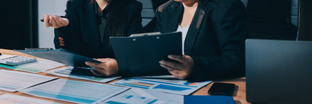 Accounting company provide finance and taxation planning for profitable cash flow, Auditor and accountant team working in office, analyze financial data and accounting record with calculator.Insightの写真素材
