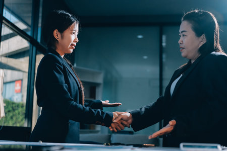 Business success. Business people shaking hands agreement confirmed in the investment business.の写真素材