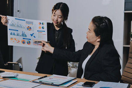 Business analyze,Close up Business people meeting to discuss the situation on the market. Business Financial Conceptの写真素材