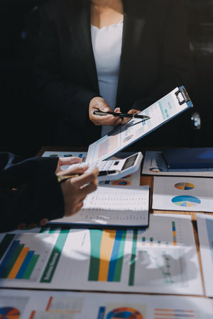 Business analyze,Close up Business people meeting to discuss the situation on the market. Business Financial Conceptの写真素材