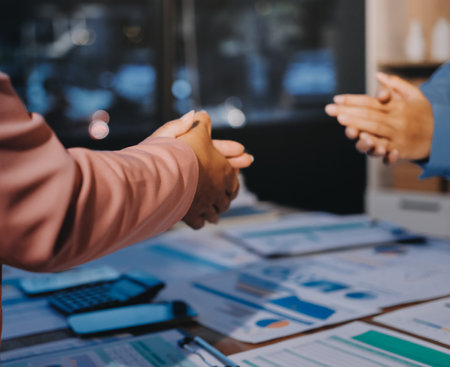 Team of businesspeople clapping hands while having a conference. Business professionals applauding at a seminar.の写真素材