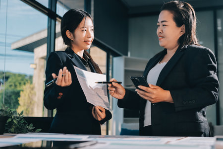 Business analyze,Close up Business people meeting to discuss the situation on the market. Business Financial Conceptの写真素材