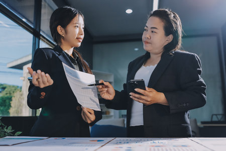 Business analyze,Close up Business people meeting to discuss the situation on the market. Business Financial Conceptの写真素材