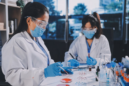 Researcher using a professional microscope
