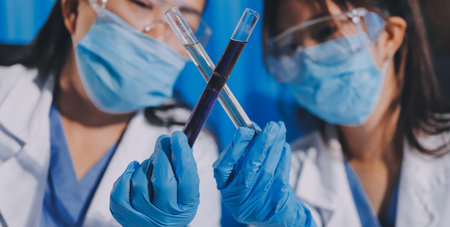 Researcher using a professional microscope