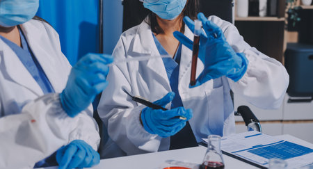 Researcher using a professional microscope