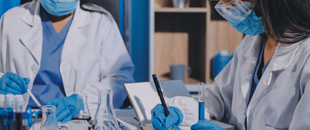 Researcher using a professional microscopeの写真素材