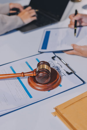 Concept of legal counseling. The lawyer or legal counsel is listening and providing advice to business people.の写真素材