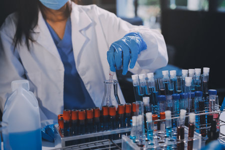 Researcher using a professional microscope