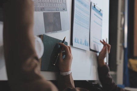 Accounting company provide finance and taxation planning for profitable cash flow, Auditor and accountant team working in office, analyze financial data and accounting record with calculator.Insightの写真素材