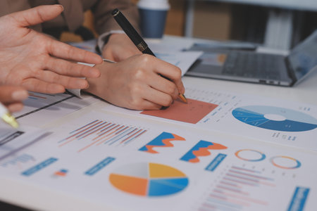 Accounting company provide finance and taxation planning for profitable cash flow, Auditor and accountant team working in office, analyze financial data and accounting record with calculator.Insightの写真素材