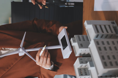 Discussion among businesspeople on the latest developments in solar cell panel technology and Solar Energy Environment city Concept.の写真素材