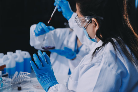 Researcher using a professional microscope