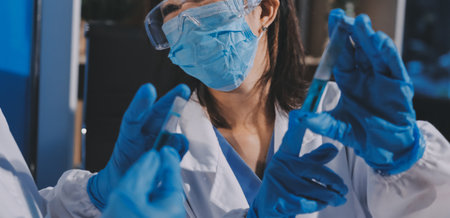 Researcher using a professional microscope