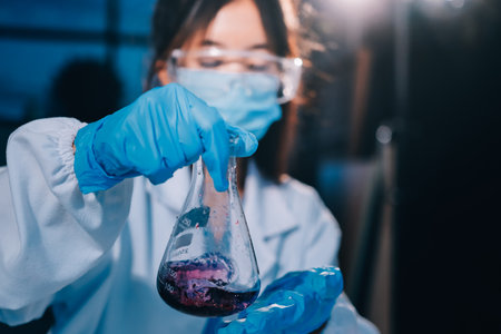 Researcher using a professional microscopeの写真素材