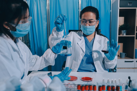 Researcher using a professional microscopeの写真素材