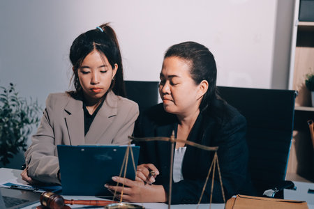 Concept of legal counseling. The lawyer or legal counsel is listening and providing advice to...