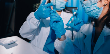 Researcher using a professional microscope