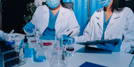 Researcher using a professional microscope