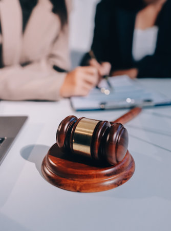 Concept of legal counseling. The lawyer or legal counsel is listening and providing advice to business people.の写真素材